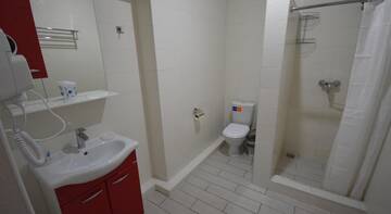 Фото номера Стандартный семейный номер Гостиница Capri Hotel г. Кабардинка 9